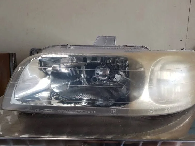 Used car headlight assembly salvaged for resale