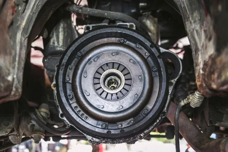 Clutch assembly exposed underneath a vehicle